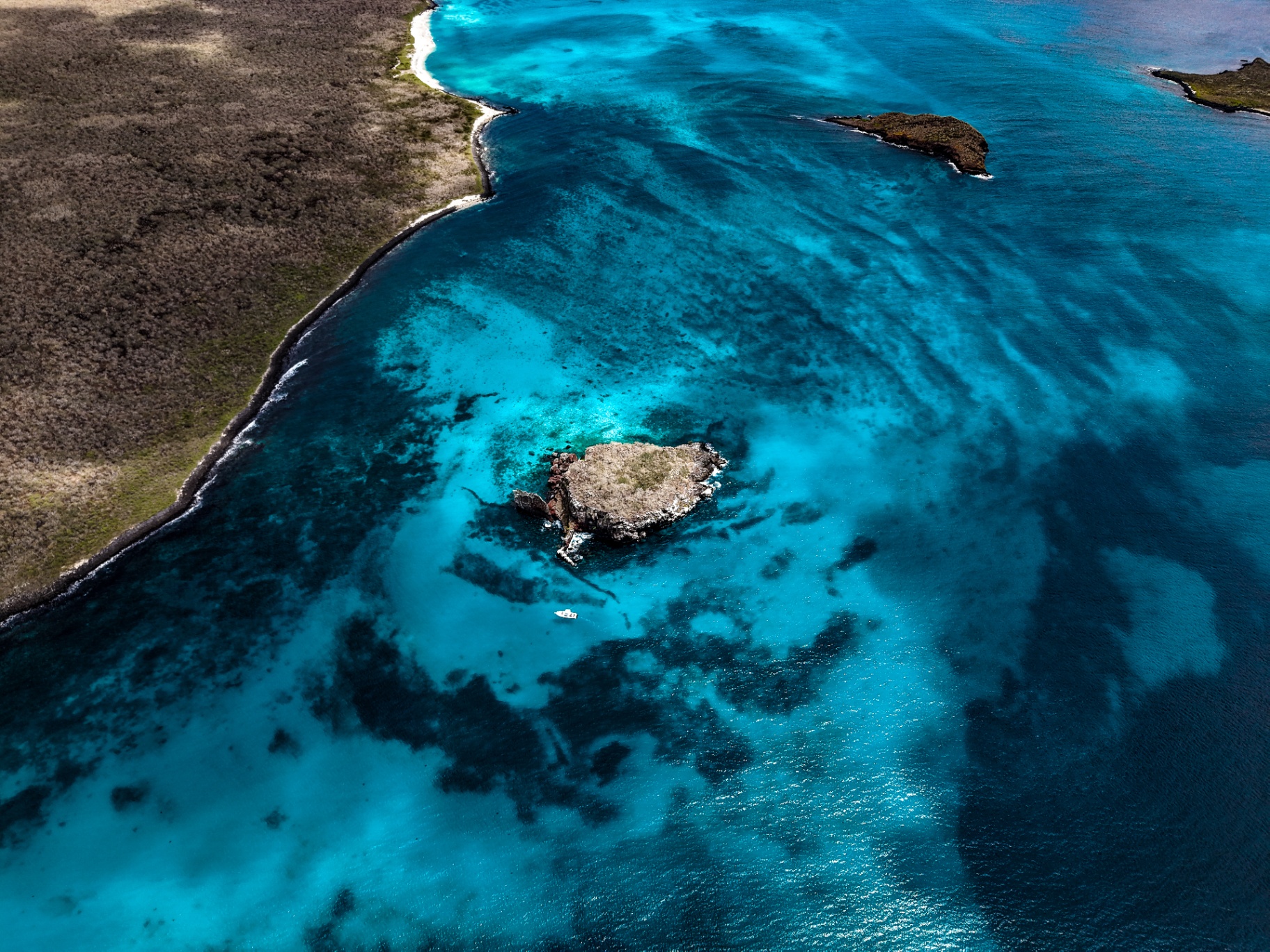 Aerial view of Isla Española turquoise waters